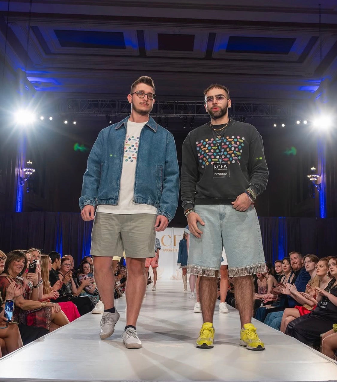 The JOHNSONANDSCOTT founders standing together after a Kansas City runway presentation.