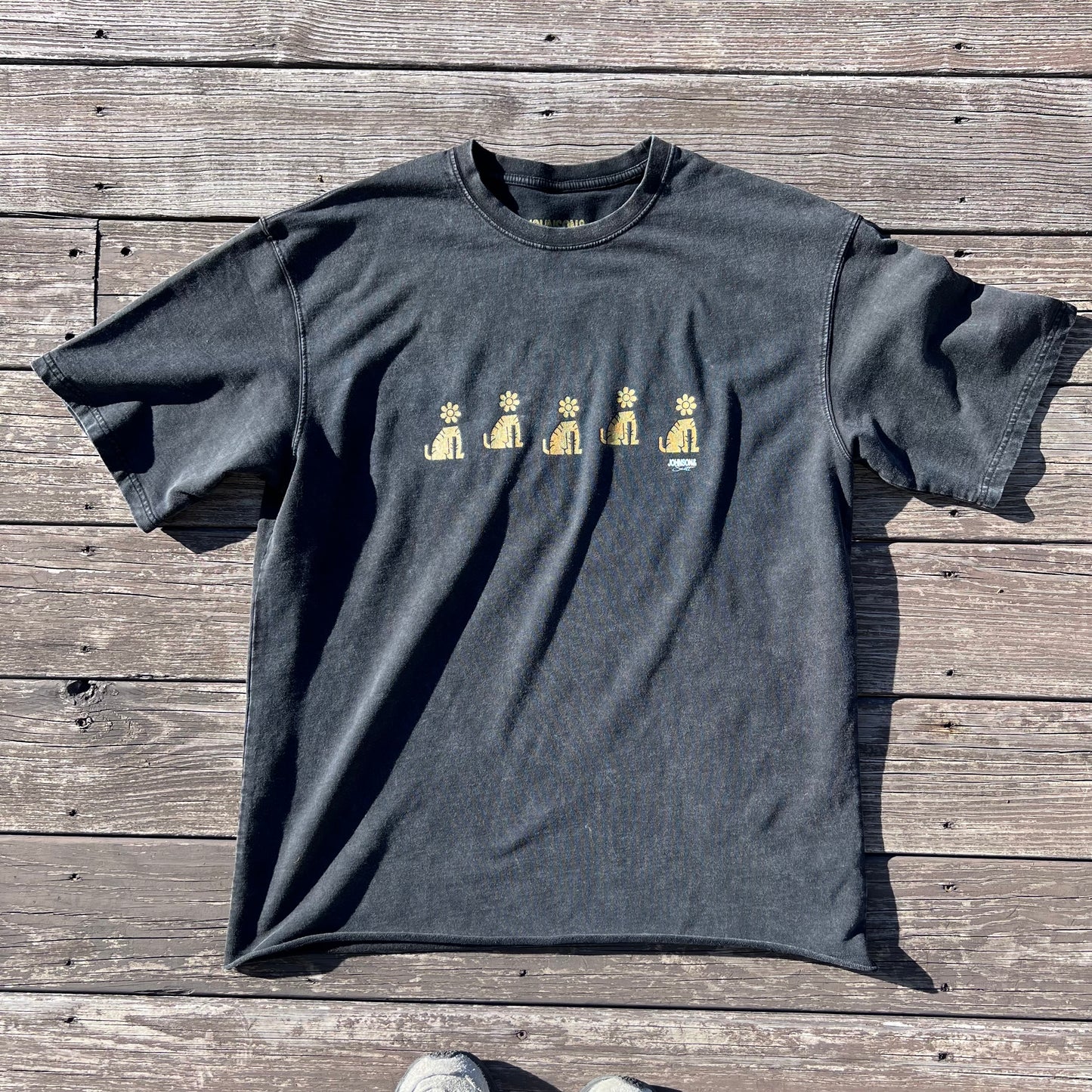 Front flat lay of the black Flowerhead Tiger Garden T-Shirt