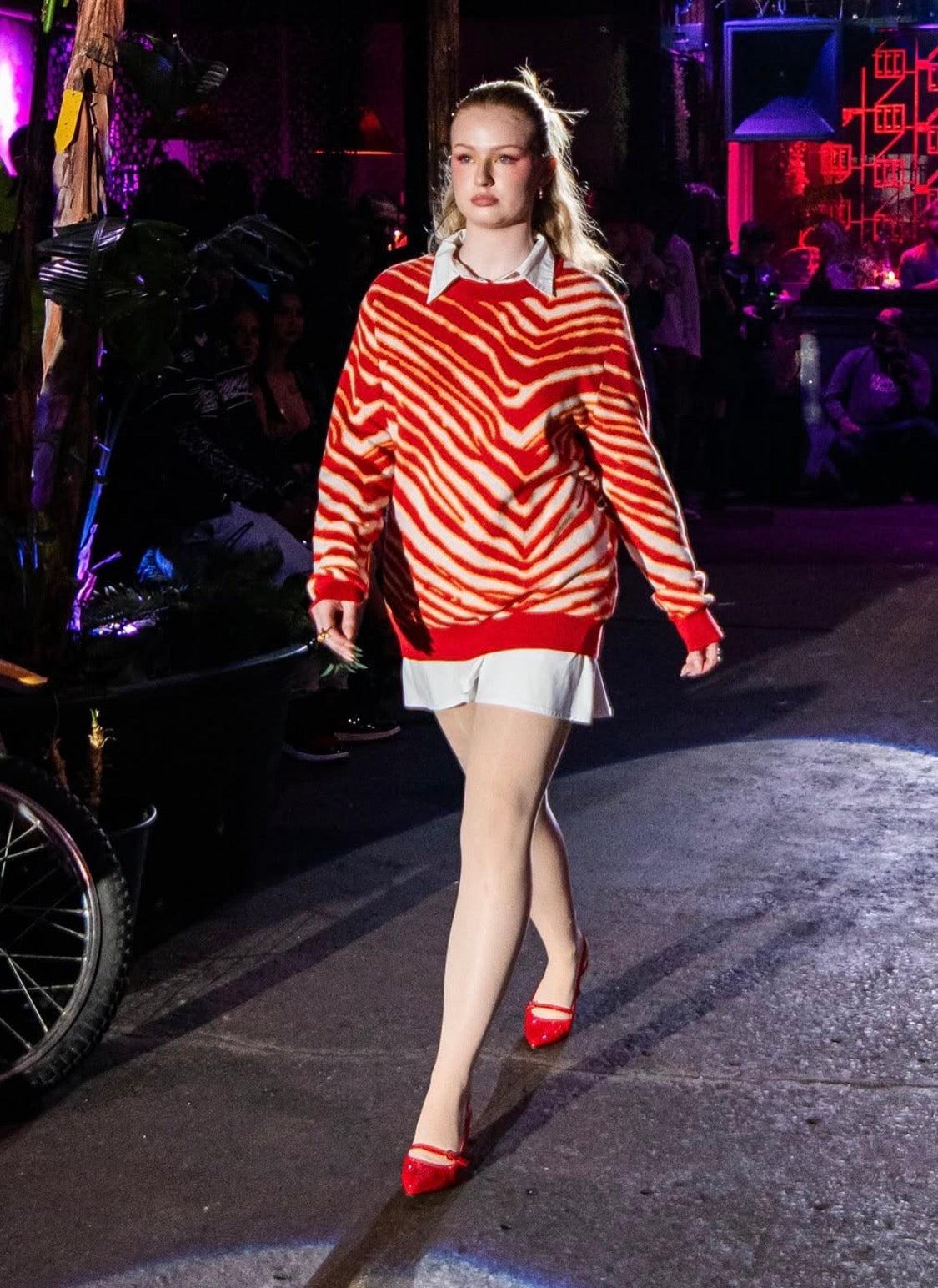 Front runway view of the red Champions Striped Knit Sweater by JOHNSONANDSCOTT